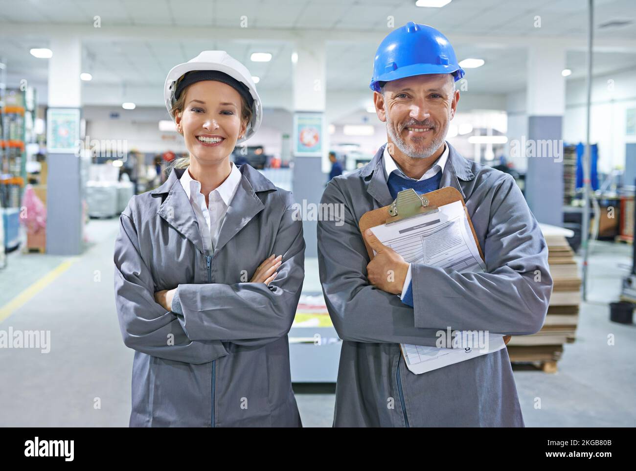 Our facility runs a smooth as silk. a people working inside a printing, packaging and distribution factory. Stock Photo