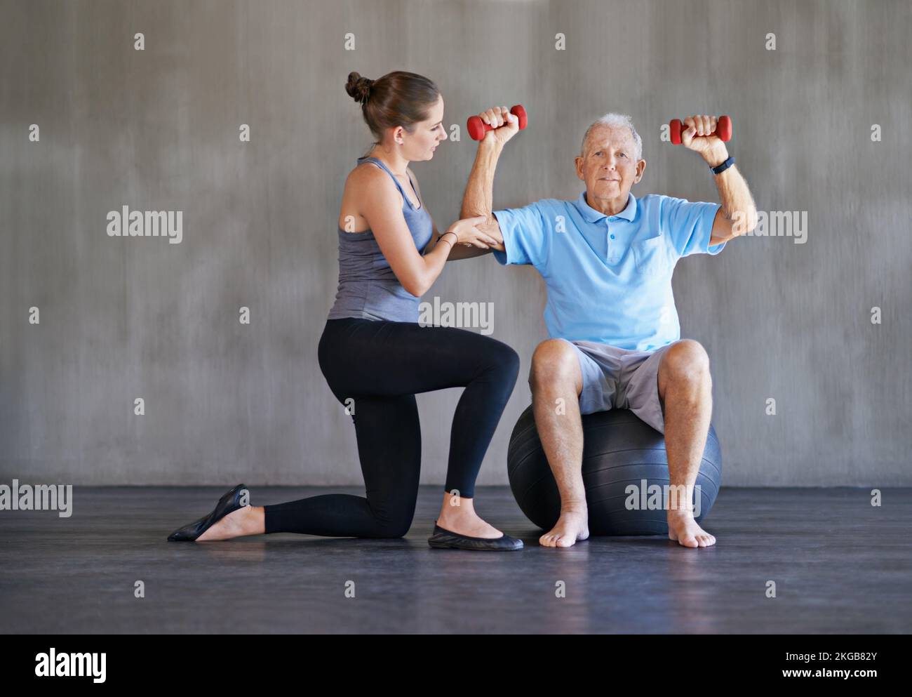 Nursing him to strength. a a physical therapist working with a senior man. Stock Photo