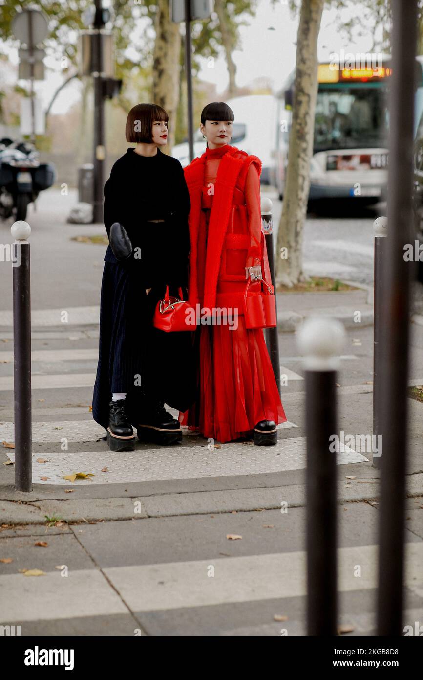 Street style, Emma and Kozue Akimoto arriving at Sacai Spring Summer