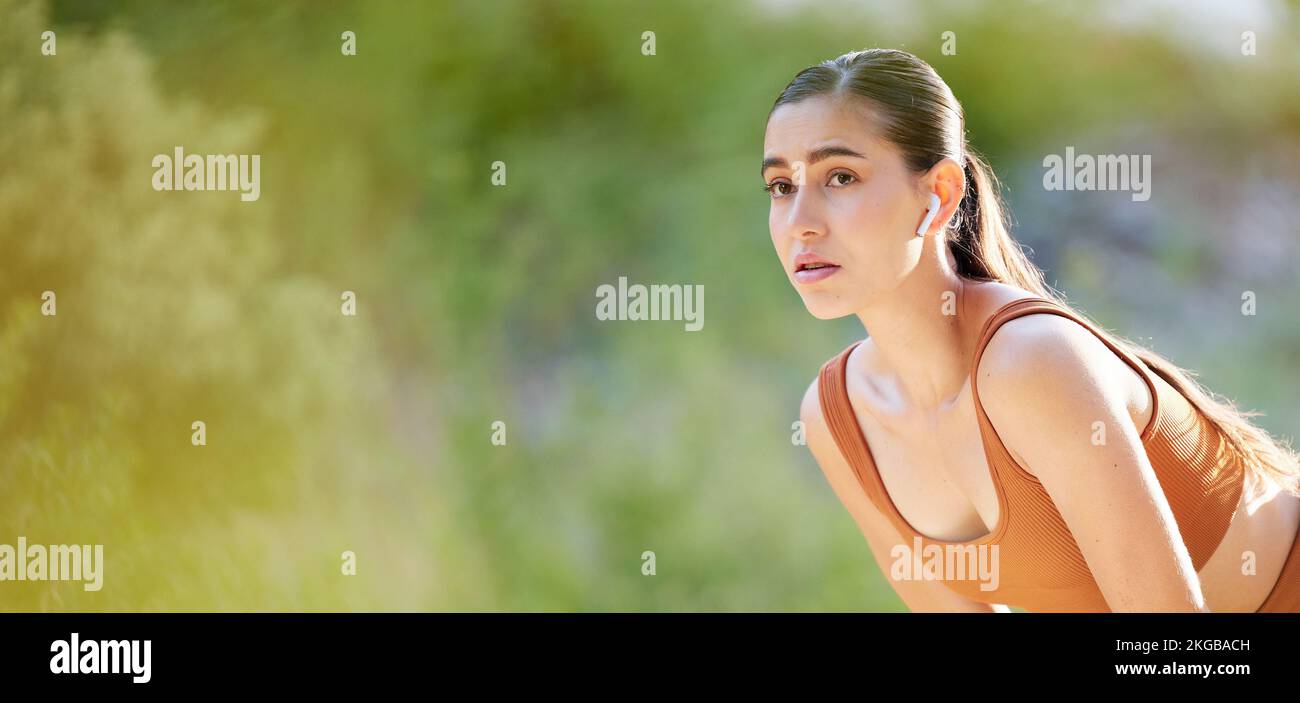 Fitness, woman and break in running exercise, workout or cardio training for healthy wellness on mockup. Active female breathing after intense run for Stock Photo