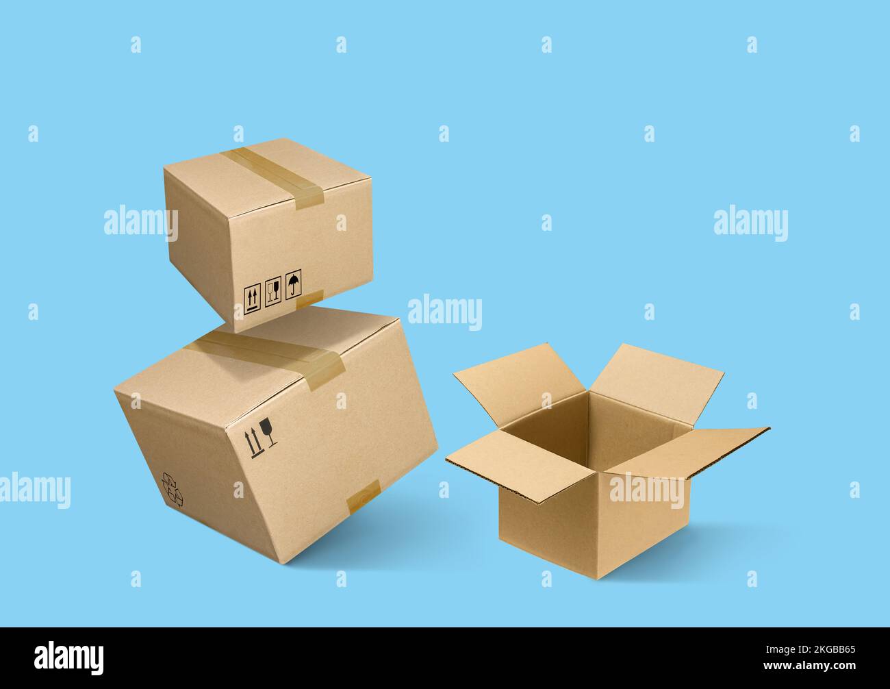Cardboard parcel boxes on a blue background Stock Photo - Alamy
