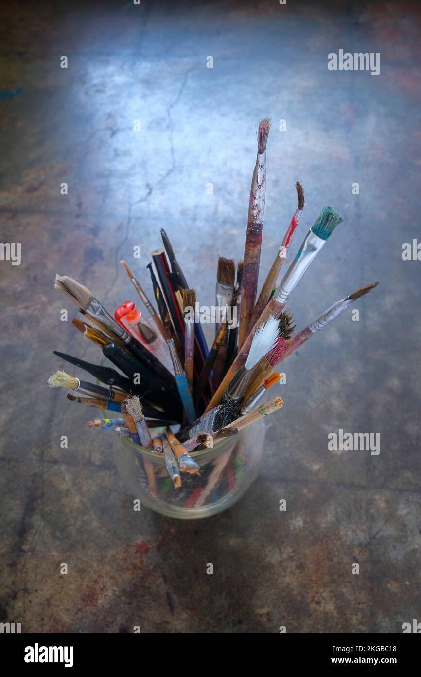 paintbrushes in glass jar Stock Photo