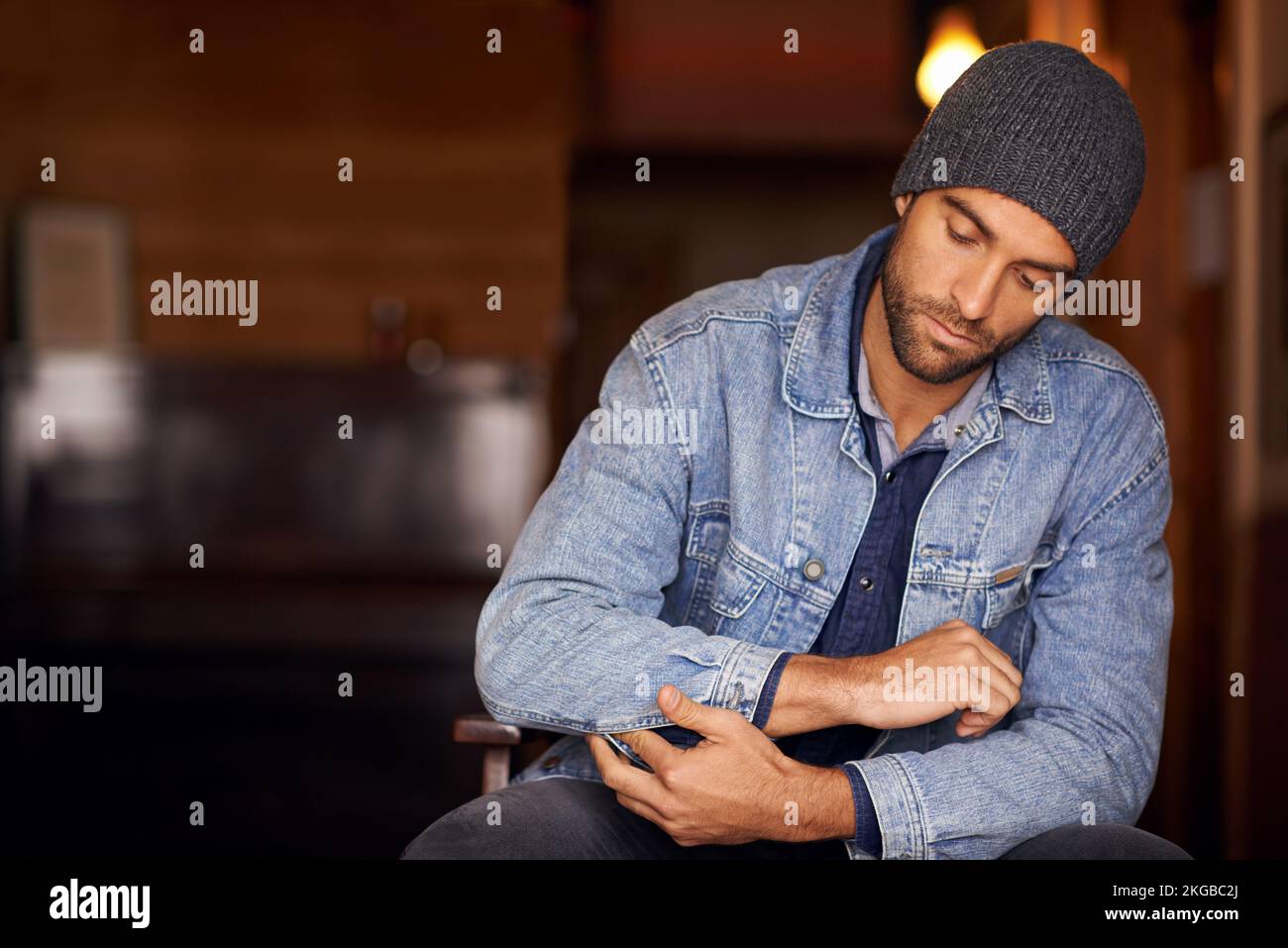 The world is full of guys, be a man. a handsome young man wearing denim clothing. Stock Photo