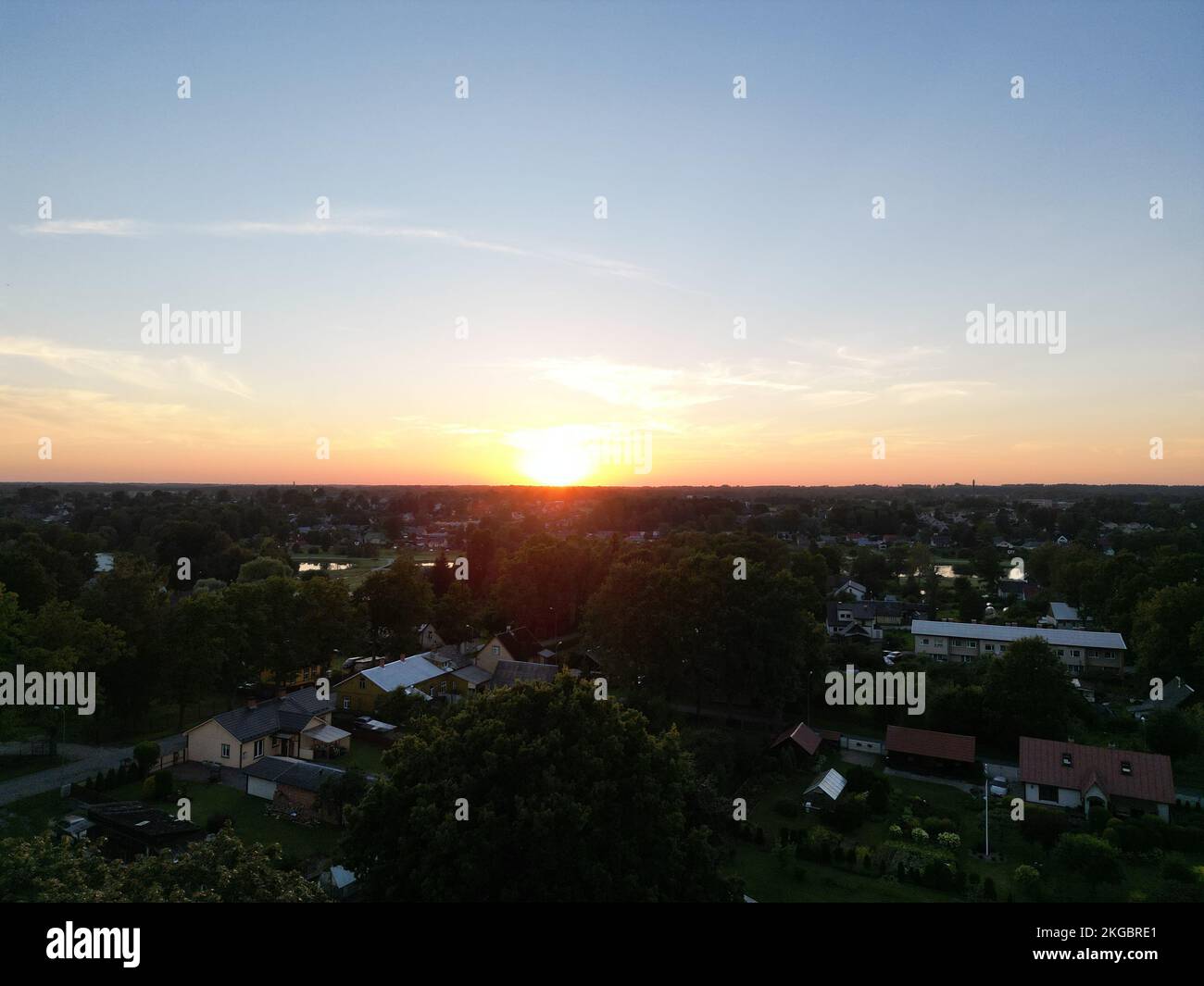 An aerial of a beautiful sunset over a green landscape Stock Photo - Alamy
