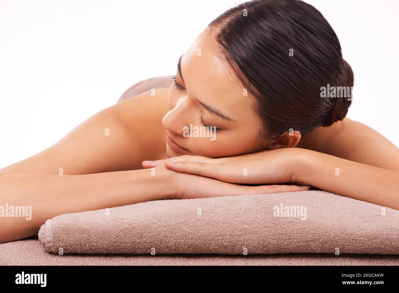 Take a day just for yourself. A beautiful young woman relaxing on a massage table before her massage. Stock Photo