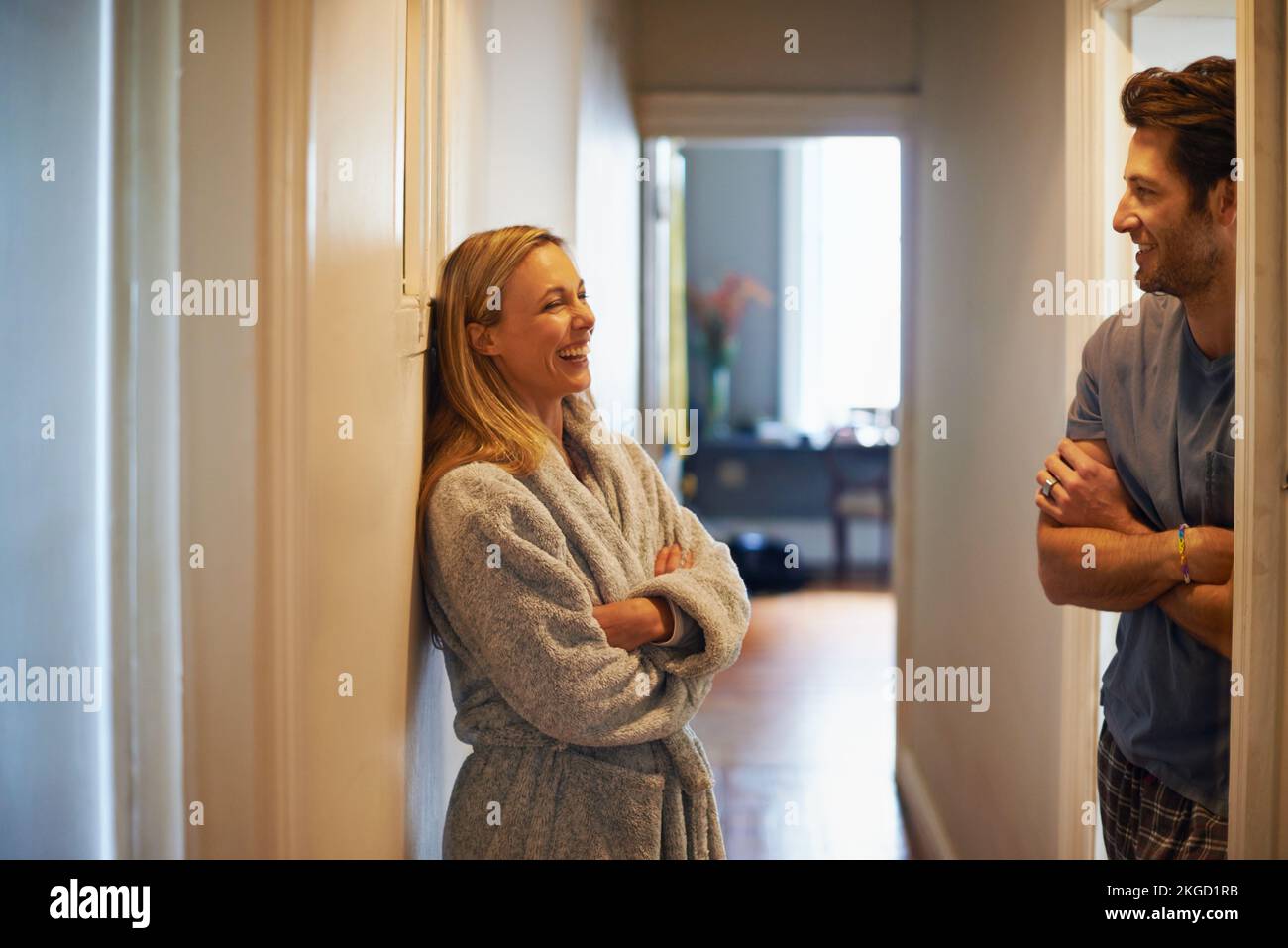 The kids have just gone to bed...a loving middle-aged couple at home. Stock Photo