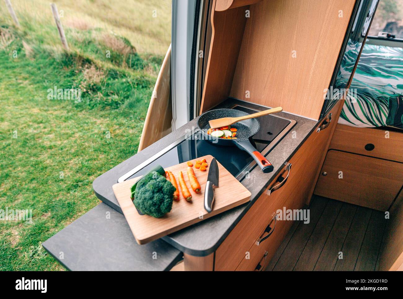 Vegan meal preparation in a campervan Stock Photo
