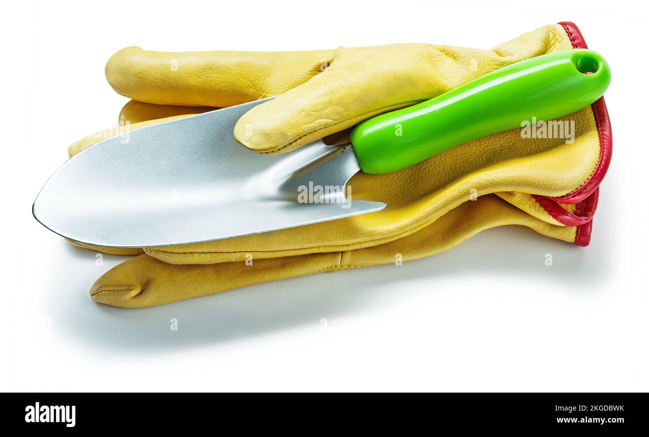 agricultural tools pair of yellow leather work gloves and hand spade