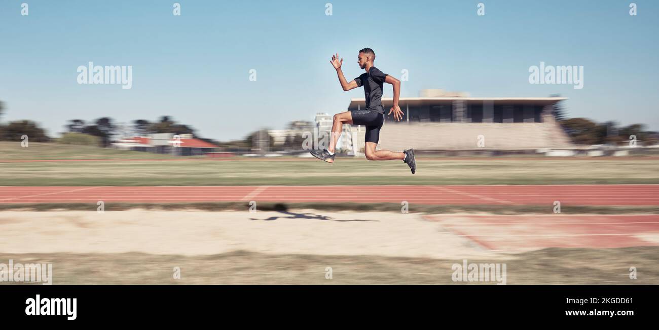Runner, man jump and sports stadium for marathon training, fitness