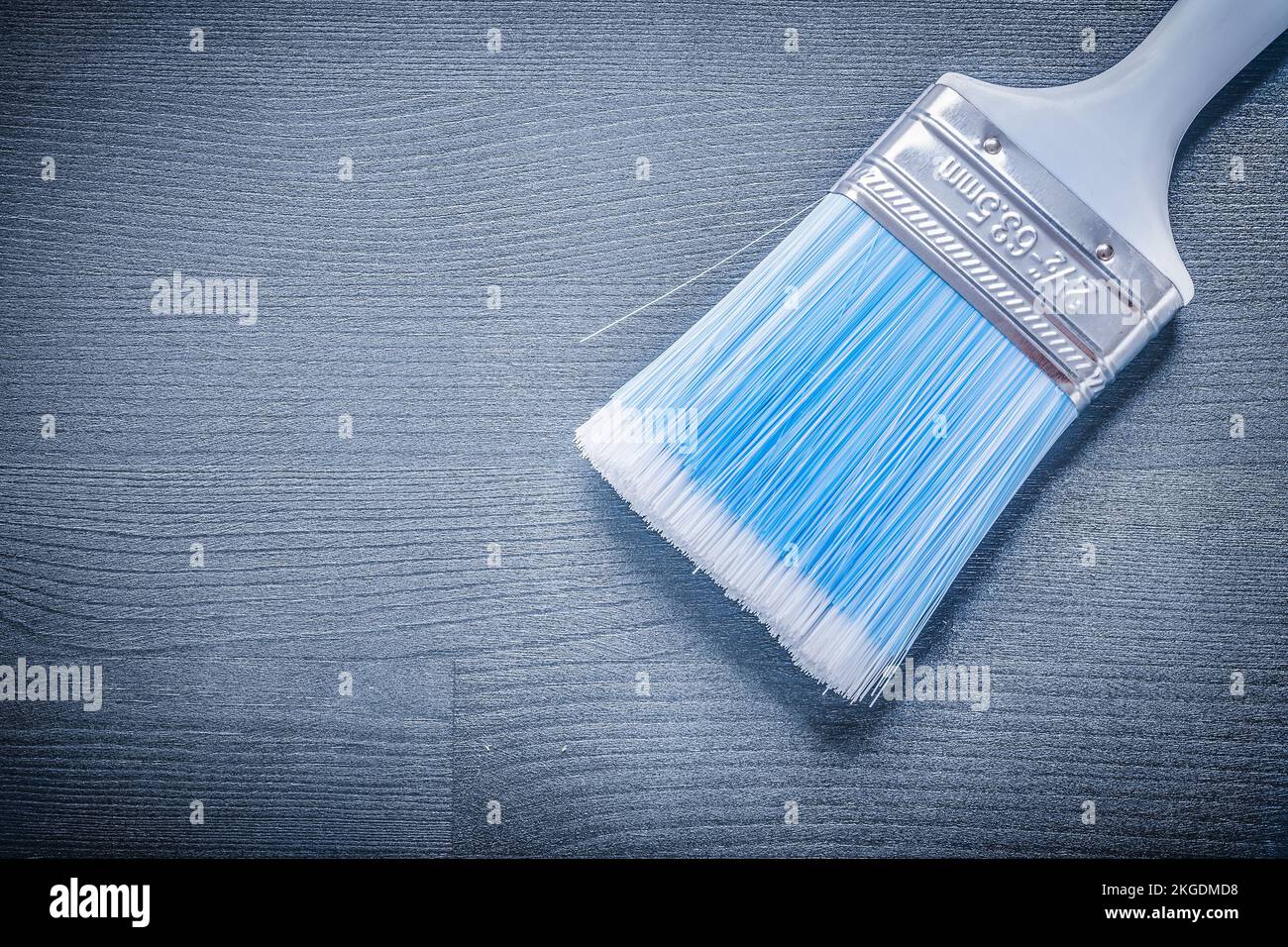 close up paint brush with blue bristle and white handle Stock Photo - Alamy