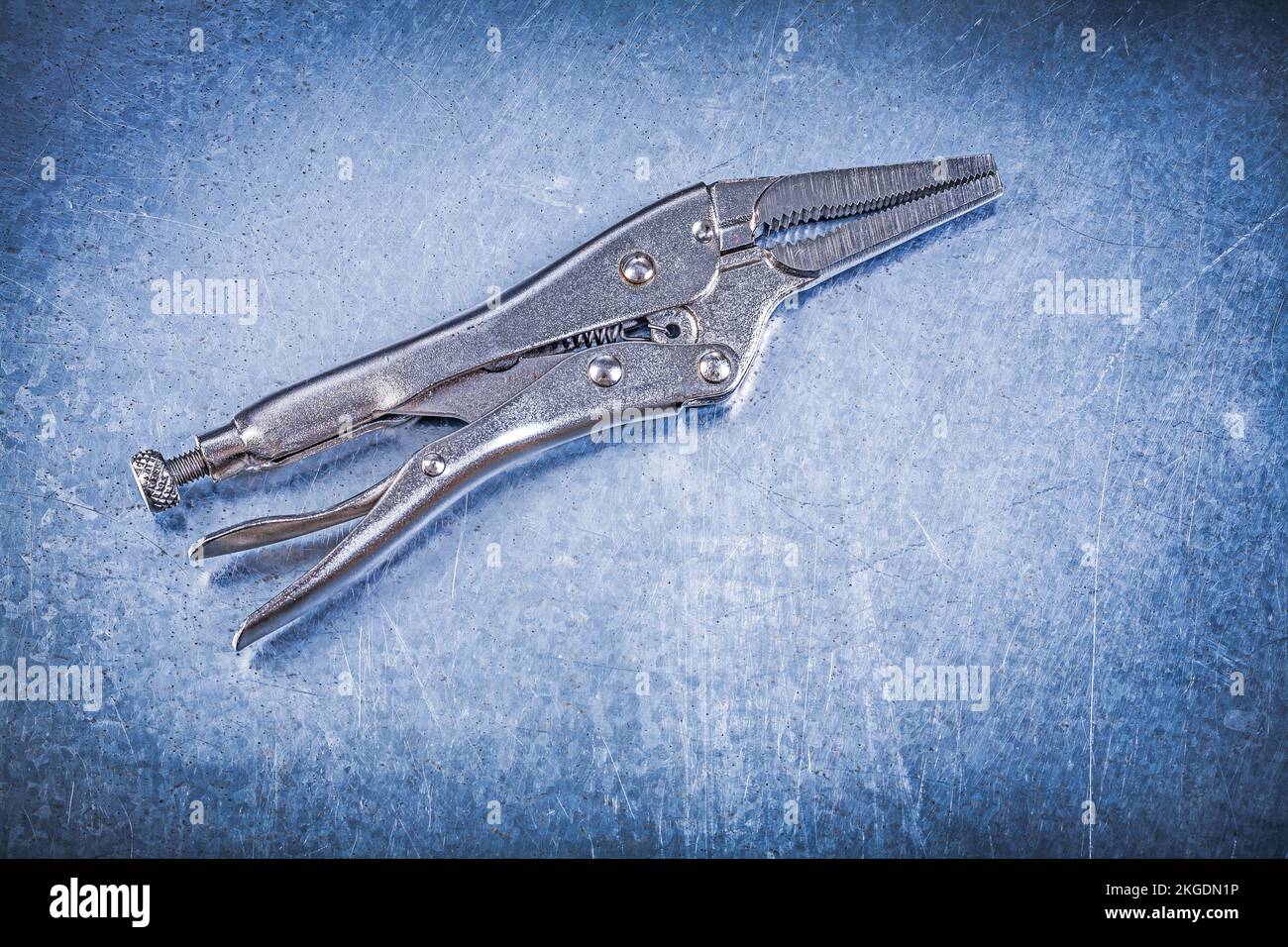 Closed lock jaw pliers on metallic background Stock Photo Alamy
