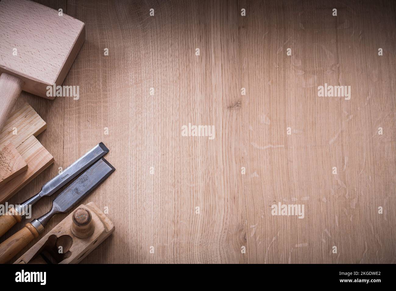 Copy space version of lump hammer planer metal chisels and wooden planks on wood board construction concept. Stock Photo