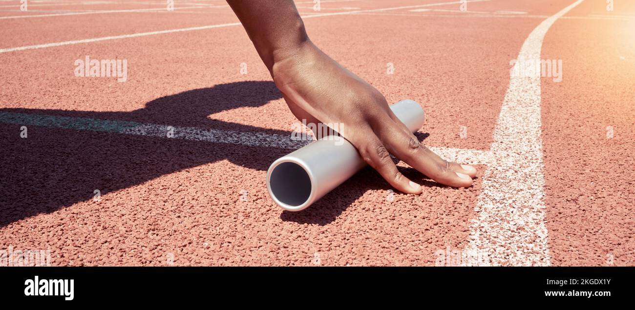 Stadium start track, athlete hands and relay ready for runner