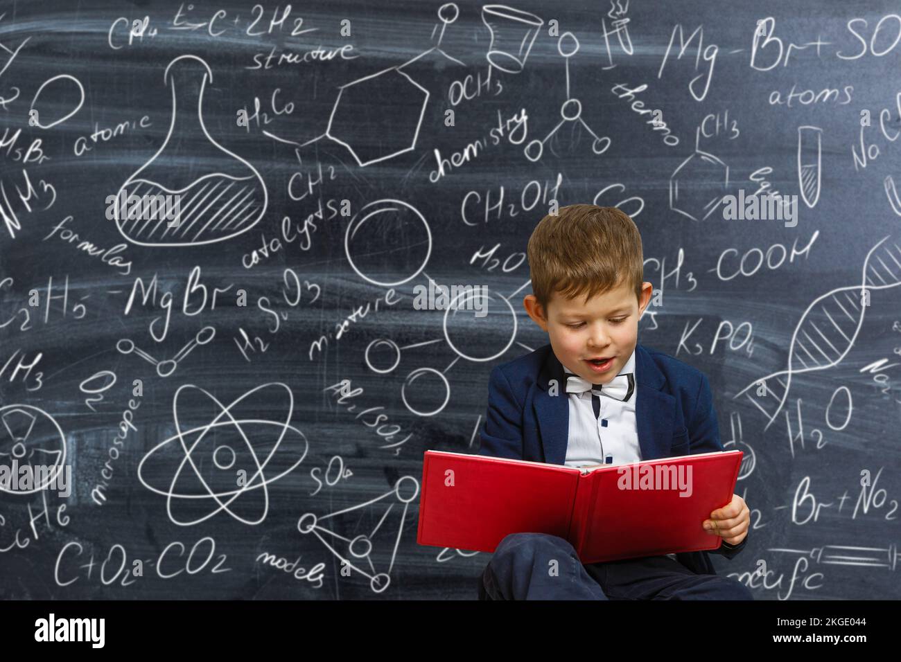 Portrait of a clever little boy in school uniform in the background of ...