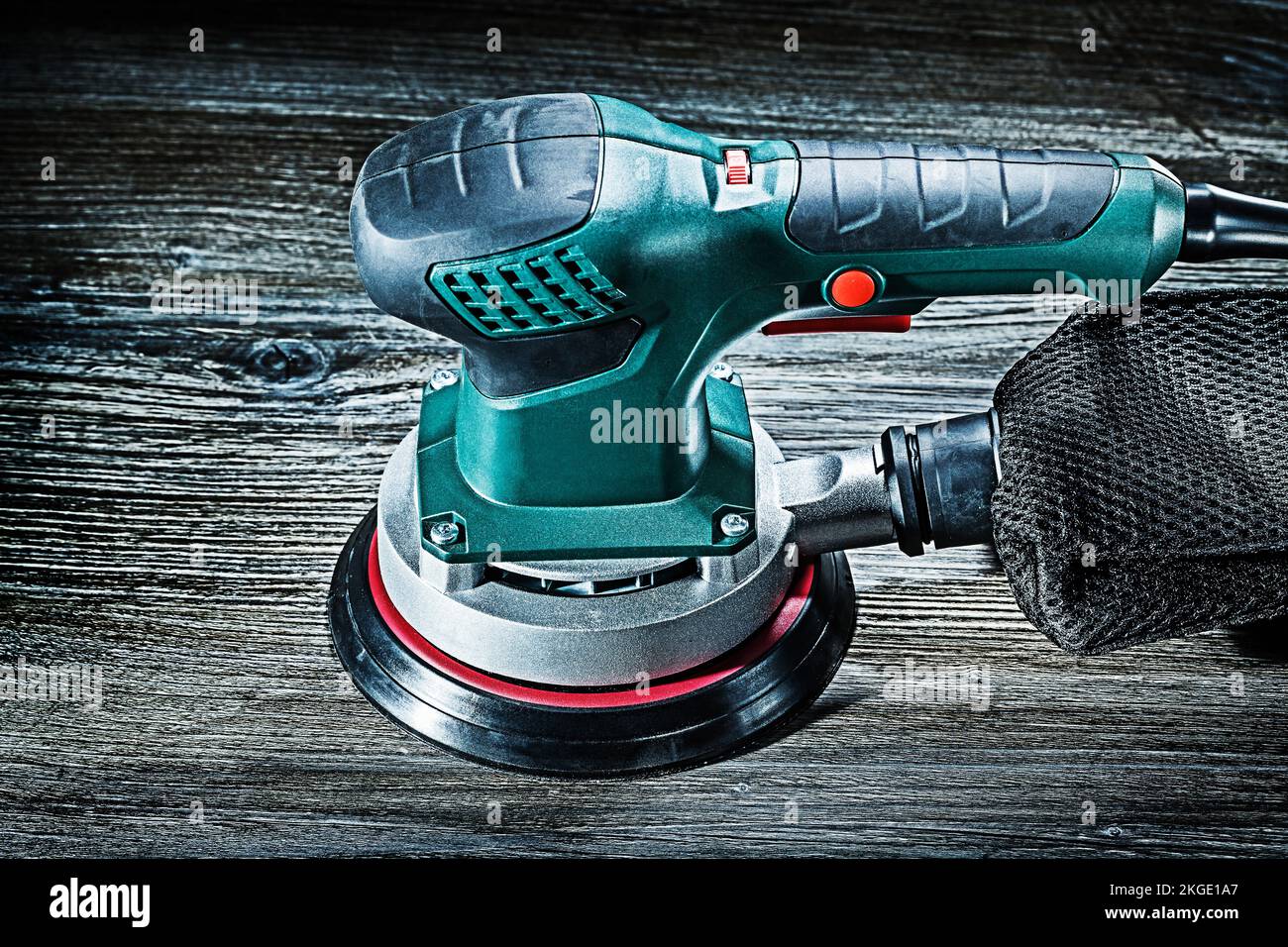 electric wood sander on vintage gray wooden background Stock Photo
