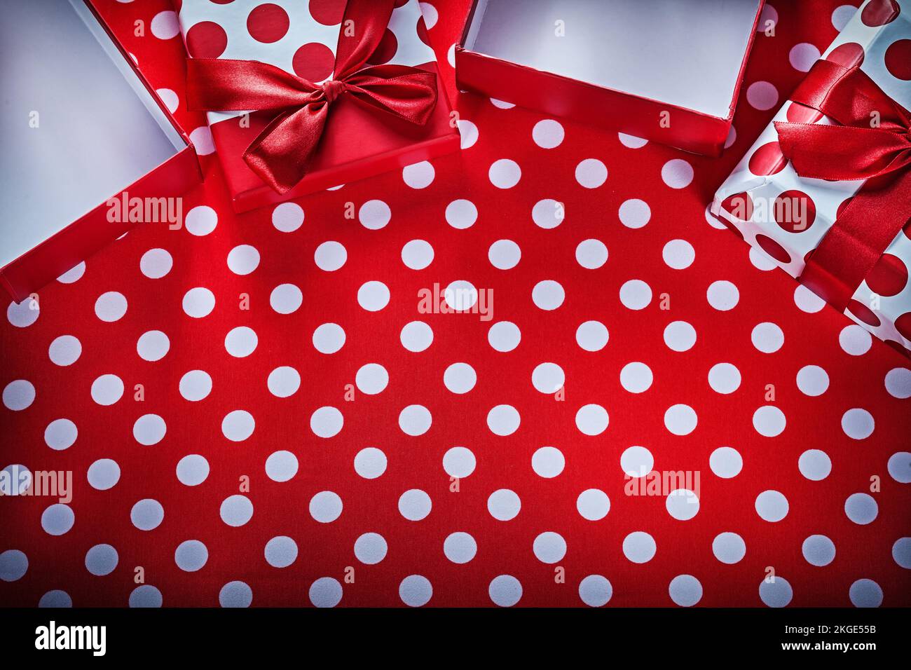 Gift boxes on polka-dot red print background celebrations concept Stock ...