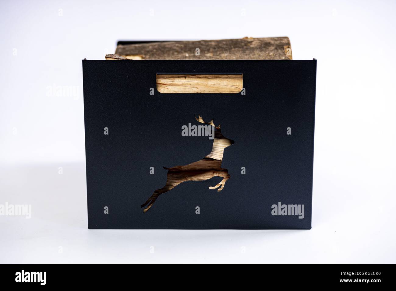 Boxed Logs A metal box for firewood with wood logs in it on white background in a ...