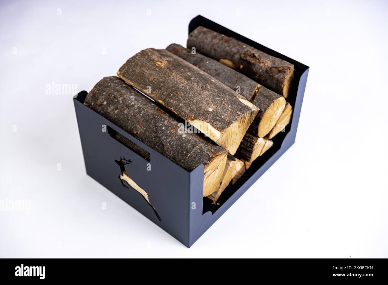 Boxed Logs A metal box for firewood with wood logs in it on white background in a ...