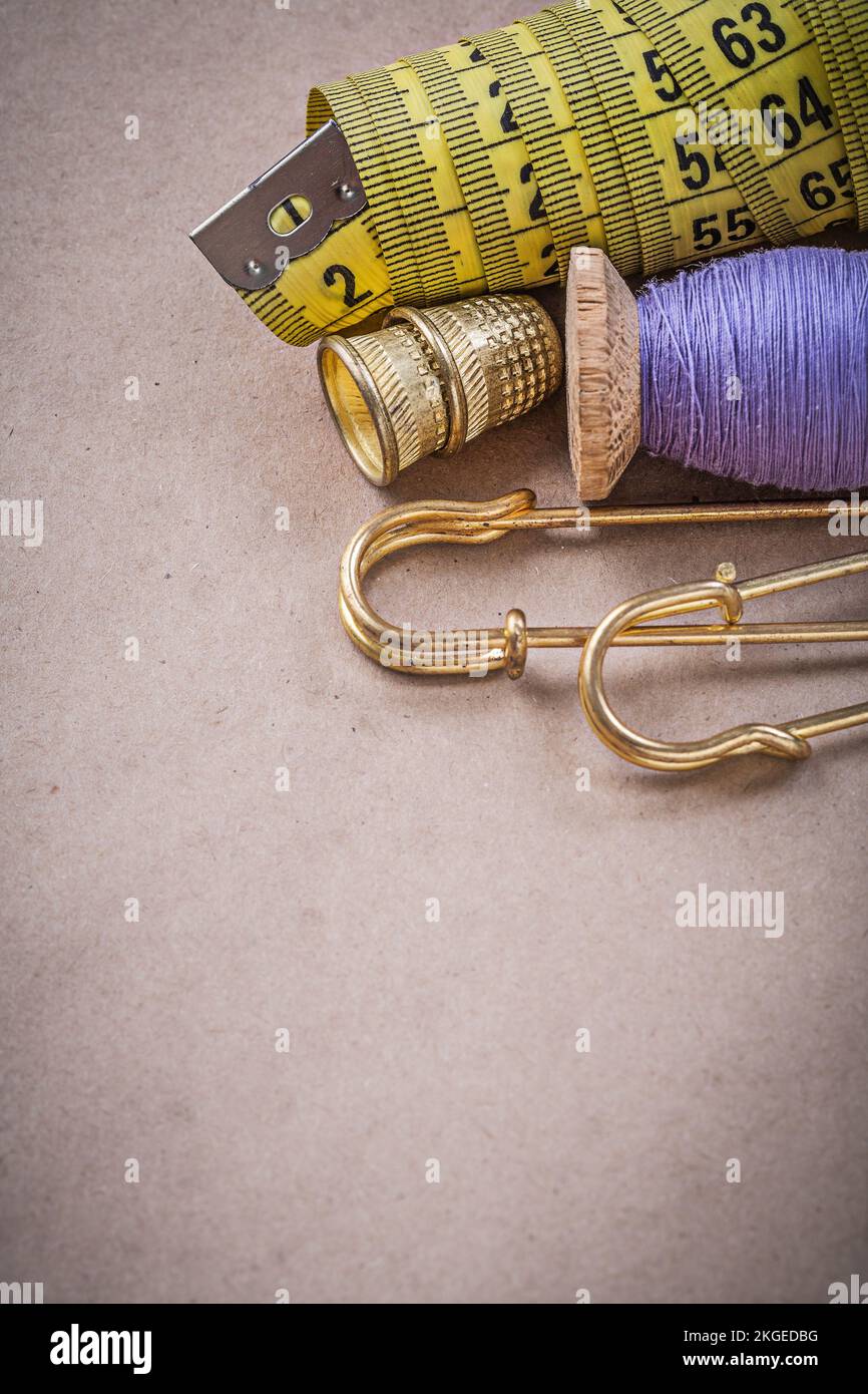 Measuring flexible ruler thread spool clasp pins thimbles Stock Photo