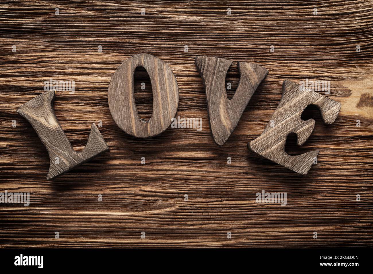 love vintage wood letters on wooden background Stock Photo - Alamy