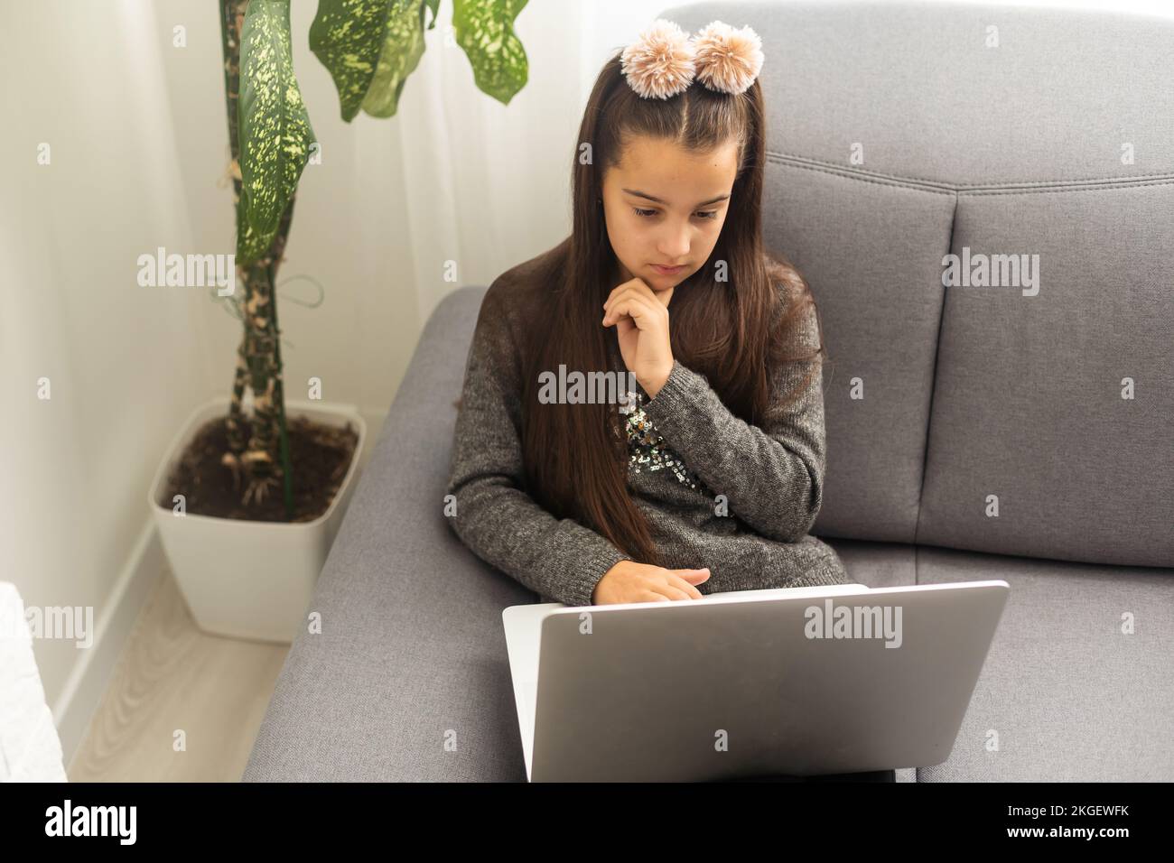 Teen girl school pupil studying online from home making notes. Teenage ...