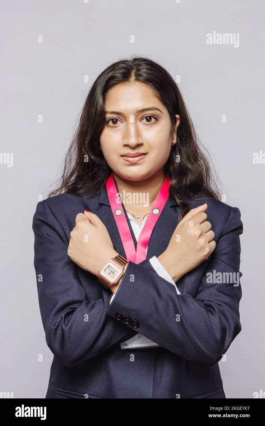 Advocating to Stop Violence Against Women: Corporate Professional Giving Cross-Hand Gesture Against Workplace Overburden. symbolizing exploitation. Stock Photo