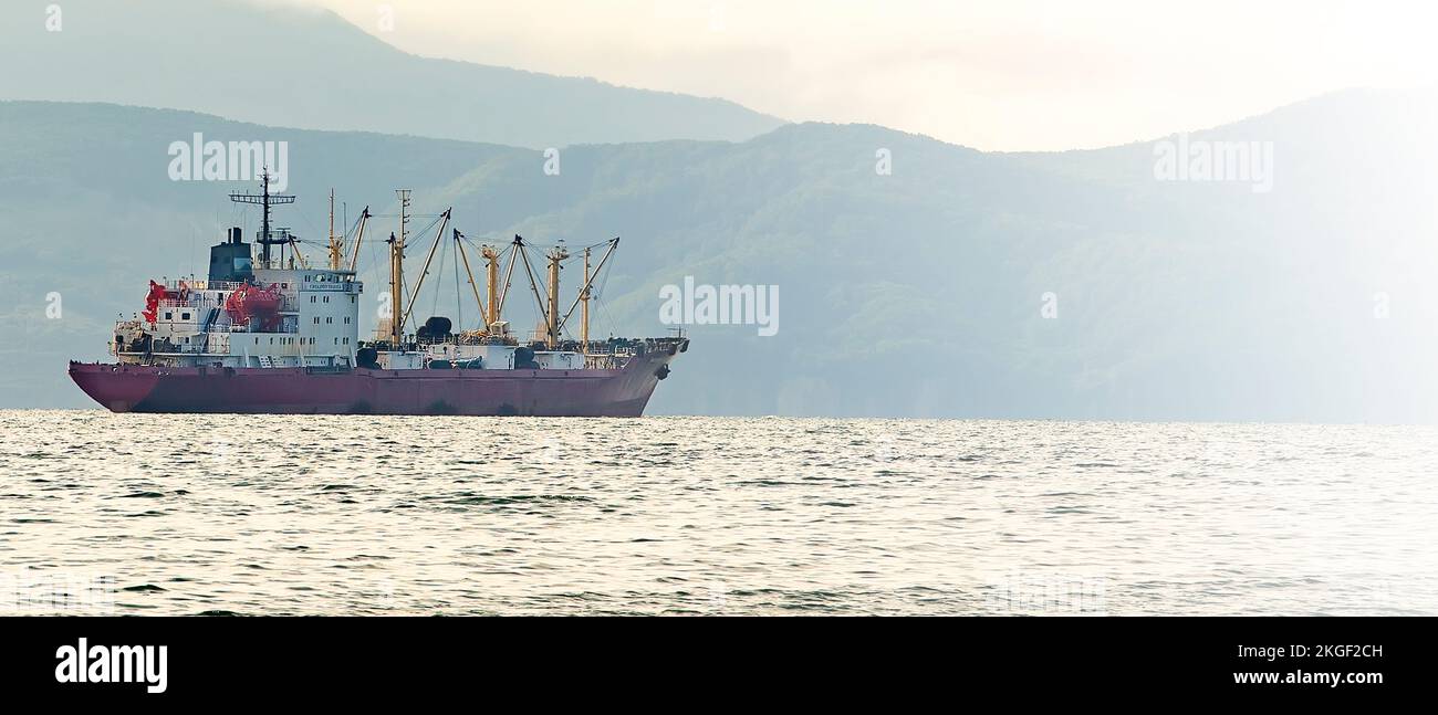 The fishing boat in gray morning on Pacific ocean off the coast of the ...