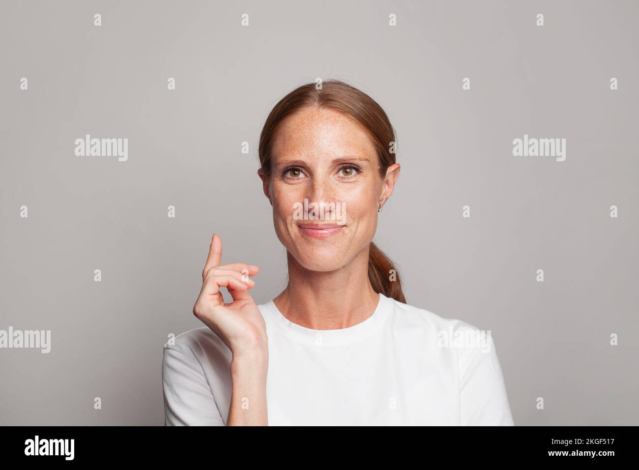 Attractive mature woman on white background portrait Stock Photo - Alamy