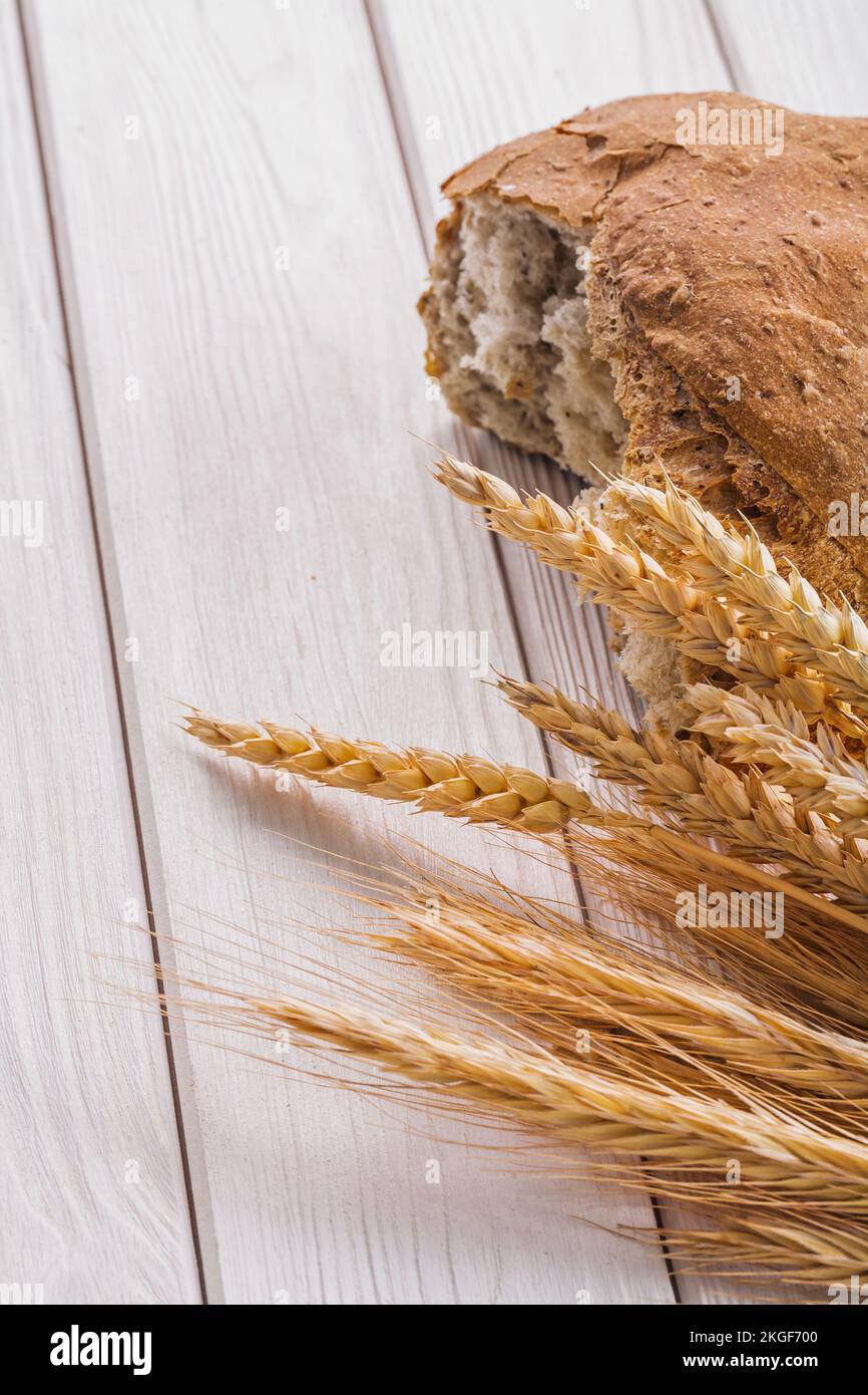 slice of bread and wheat ears on white boards Stock Photo - Alamy