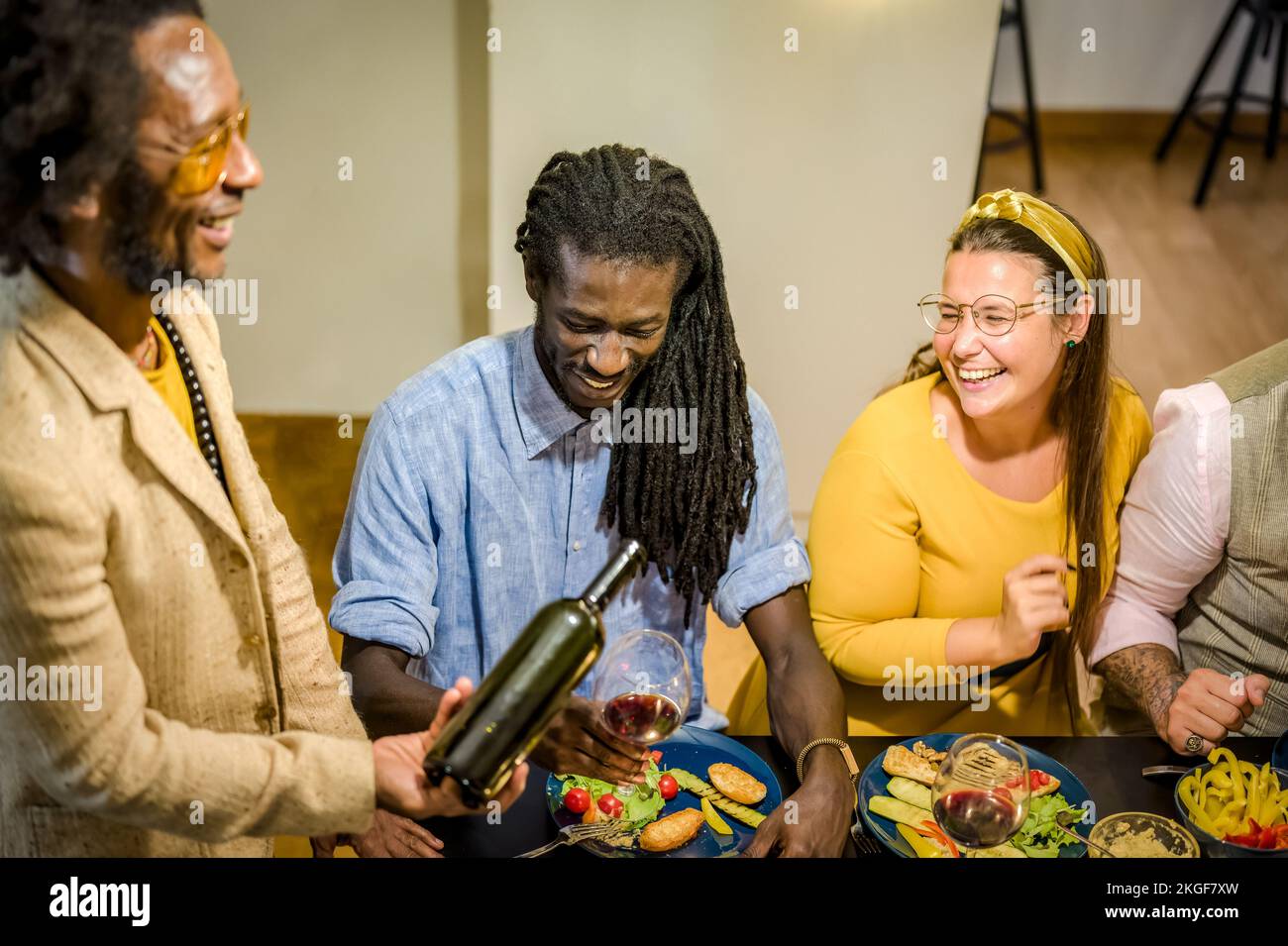 Happy vegan friends eating and drinking, deverse people smiling and