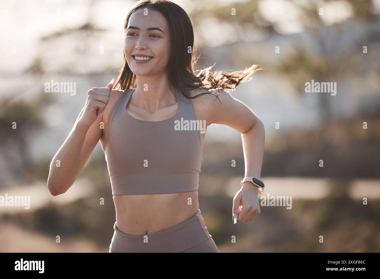 Fitness, motivation or woman running on road or street training, exercise or wellness workout on mountain or nature. Health, sports or happy runner Stock Photo