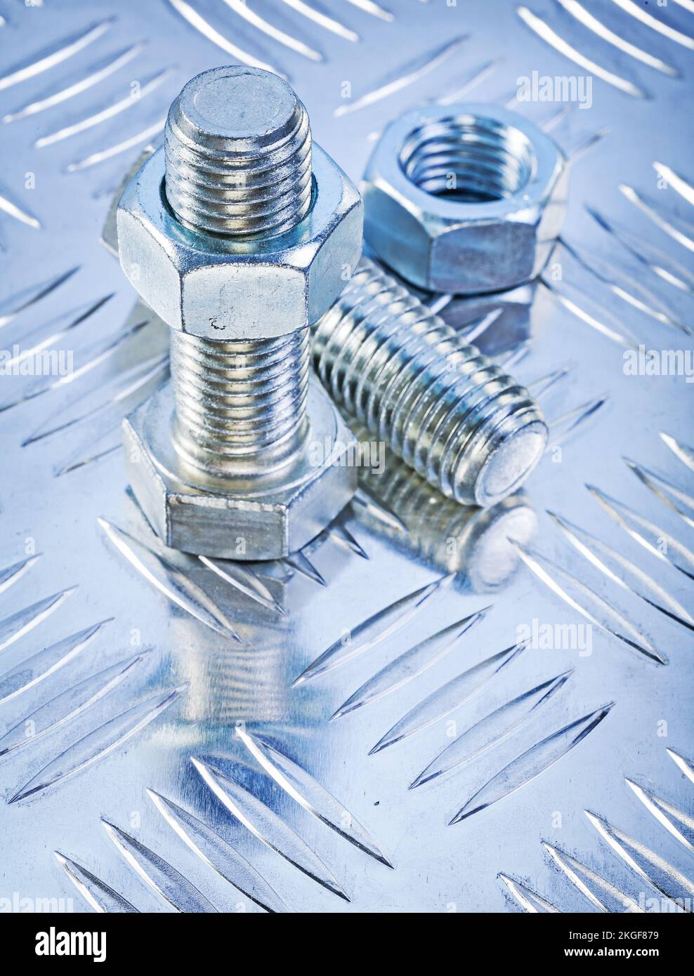 Stainless bolt details and construction nuts on channeled metal sheet