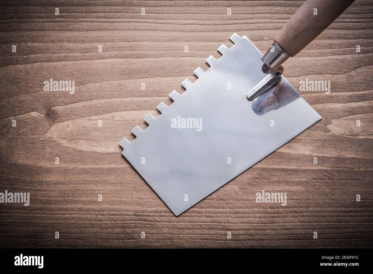 stainless steel putty knife with wooden handle Stock Photo Alamy