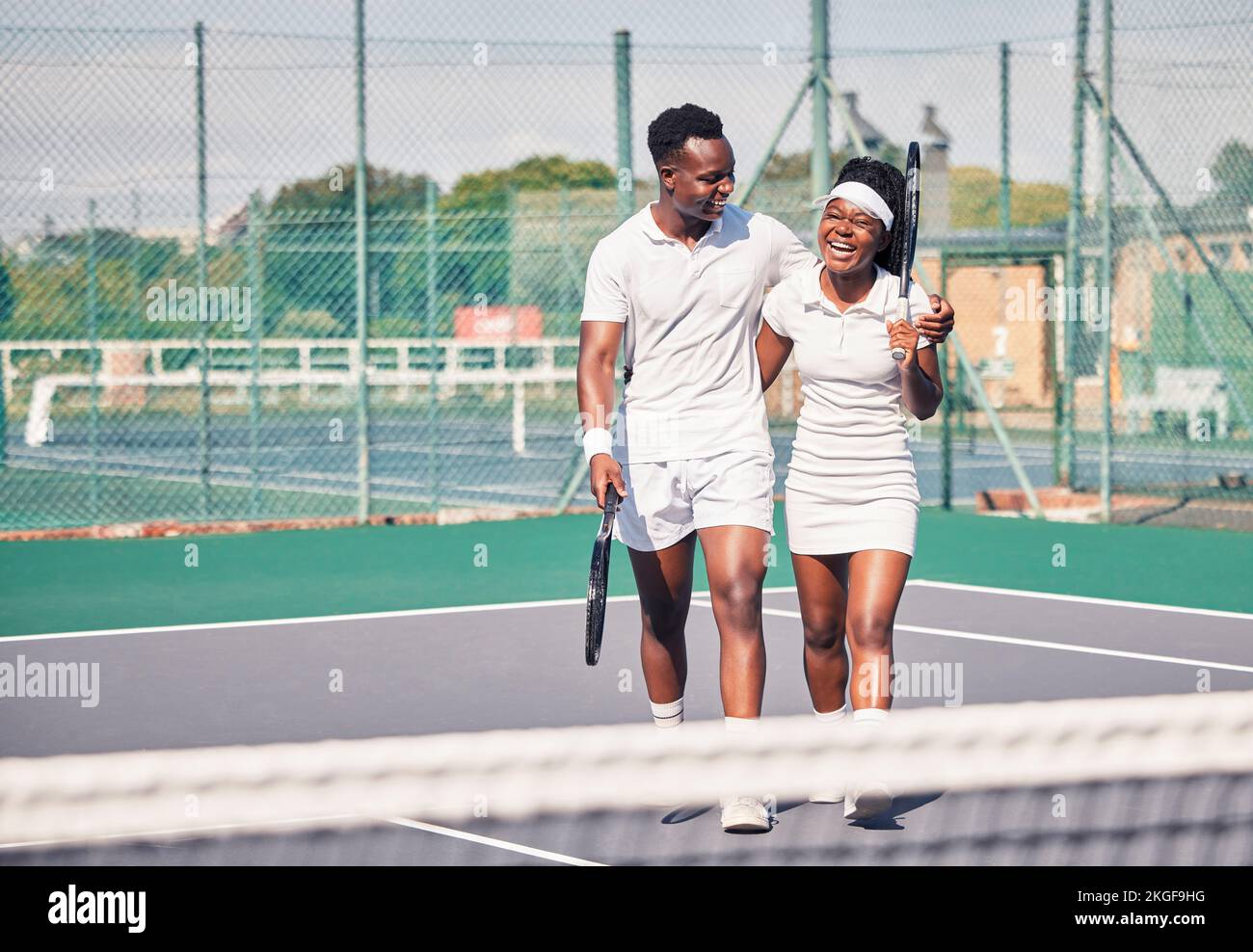 Tennis, black couple and on court for training, smile and happy together outdoor for wellness, health or fitness. Sport, healthy man and woman Stock Photo