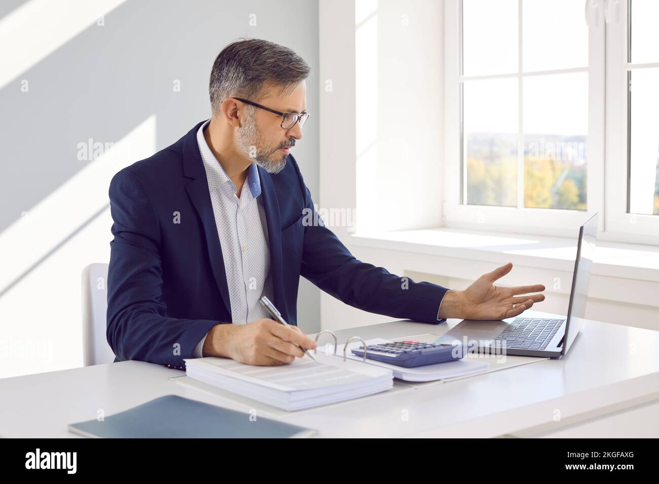 Businessman feels frustrated and stressed due to lack of money, bankruptcy or financial losses. Stock Photo