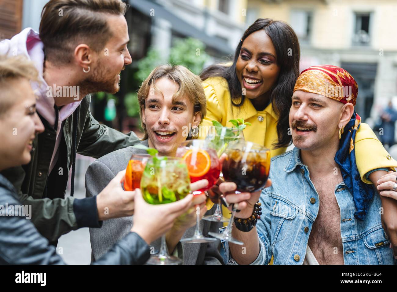 Group of diverse people toasting with beverage, happy friends ...
