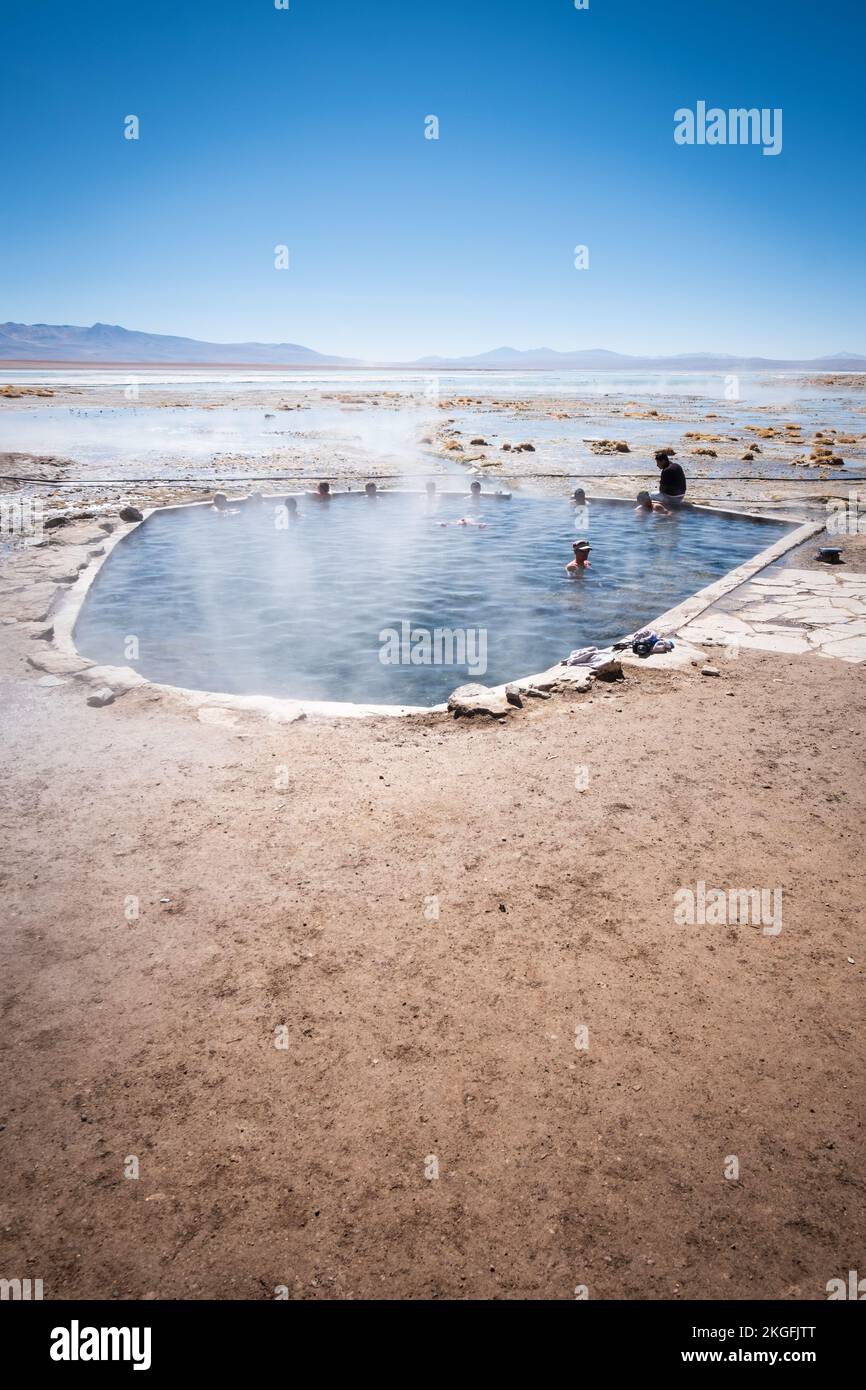 Tourists bathing at Termas de Polques (Polques Hot Springs) in Eduardo Avaroa Andean Fauna National Reserve, Sur Lípez Province, Bolivia Stock Photo