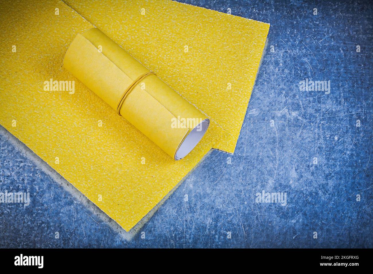 Yellow rough sandpaper on scratched metallic background abrasive equipment Stock Photo Alamy