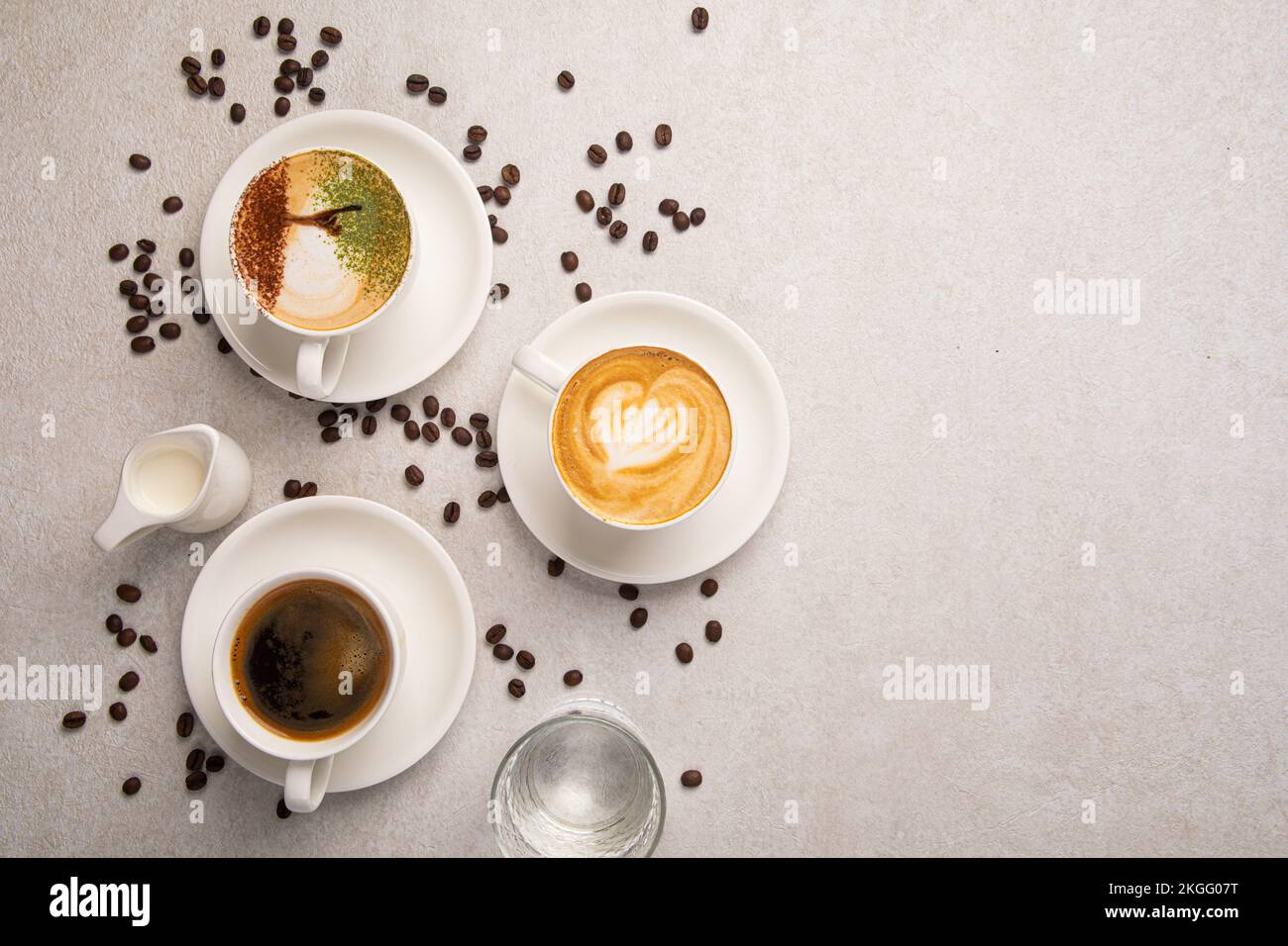 Assorted cups of coffee on the white background Stock Photo