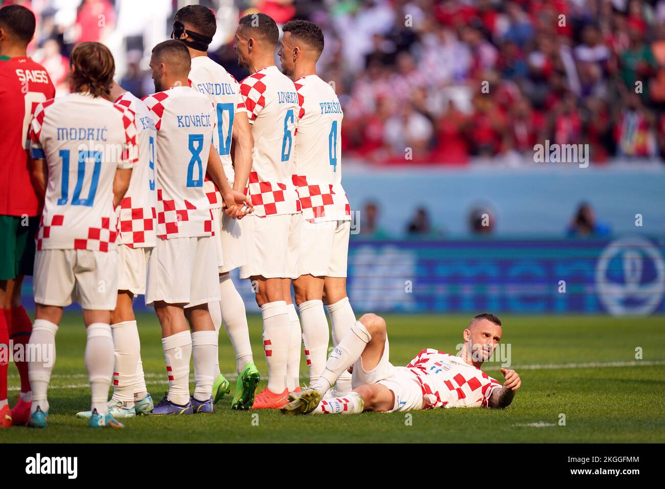 Croatia’s Marcelo Brozovic lies down behind a defensive wall to defend a free kick during the FIFA World Cup Group F match at the Al Bayt Stadium, Al Khor, Qatar. Picture date: Wednesday November 23, 2022. Stock Photo