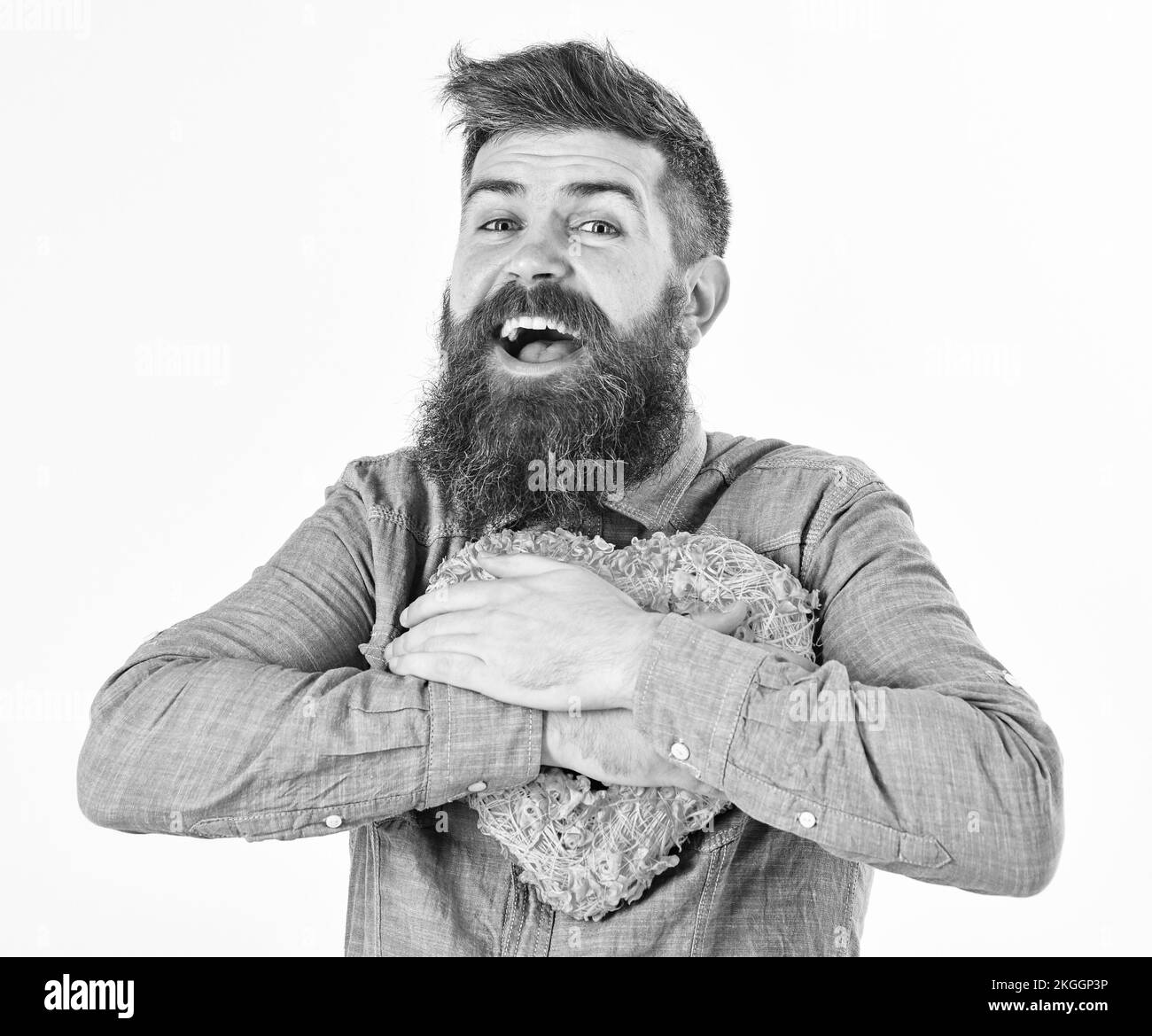 Handsome romantic guy holding a pink heart Stock Photo Alamy