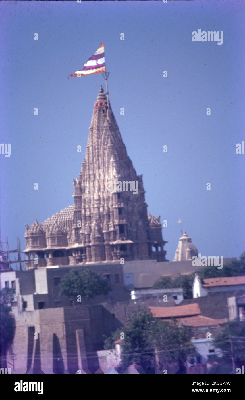 The temple's prime deity is Lord Krishna, who is called Dwarkadhish or King of Dwarka. Dwarkadhish Temple Gujarat: Situated at the cusp of Gomti River and the Arabian Sea in Gujarat Stock Photo