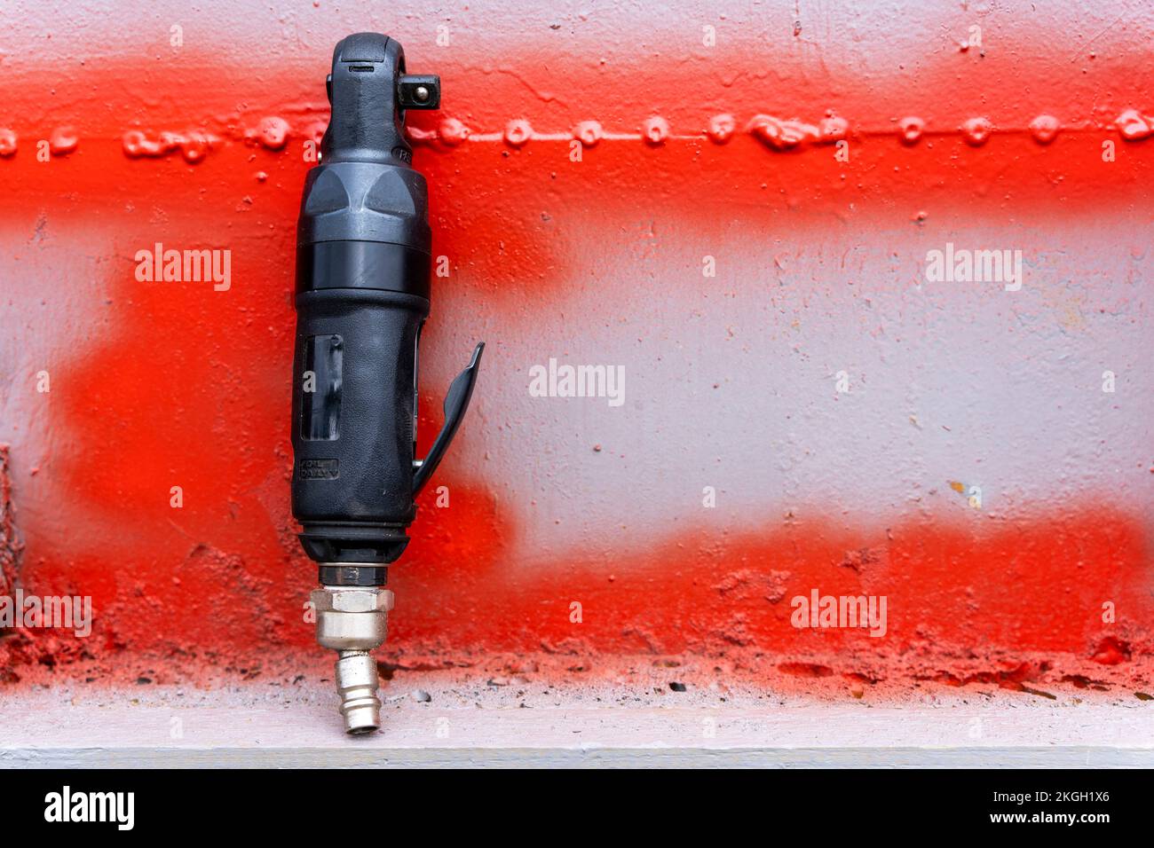 air ratchet wrench. angular pneumatic wrench on a gray background Stock Photo