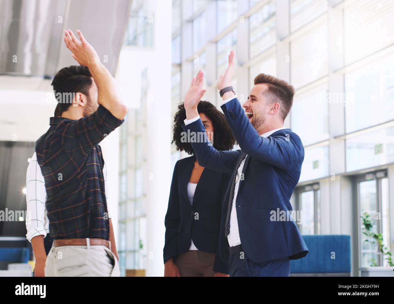 Success, office and excited business people high five after good