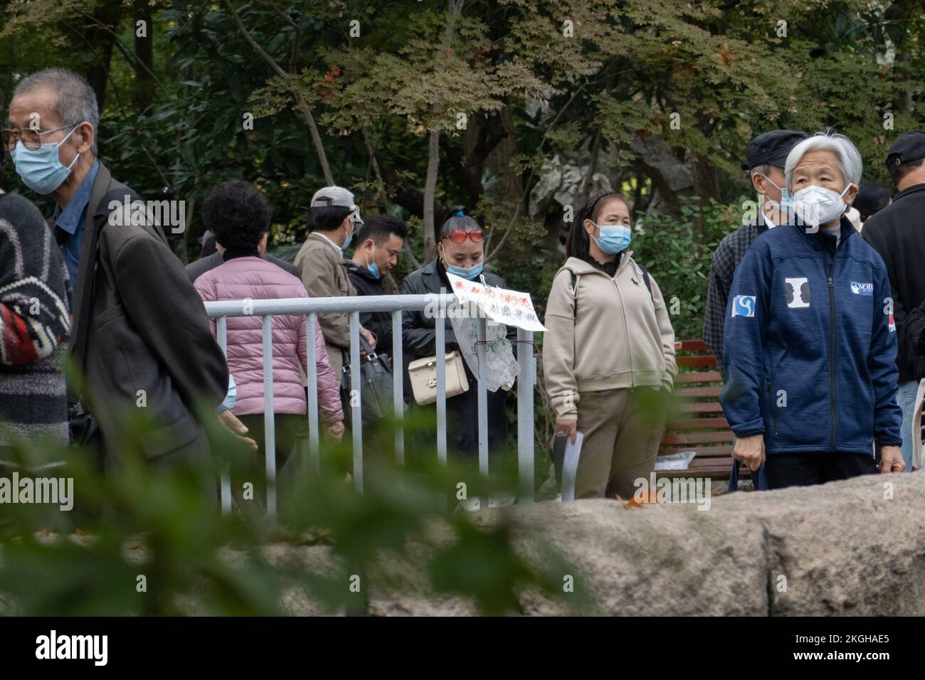 SHANGHAI, CHINA - NOVEMBER 23, 2022 - Elderly people chat to find dates for their children at Lu Xun Park in Shanghai, China, November 23, 2022. It is Stock Photo