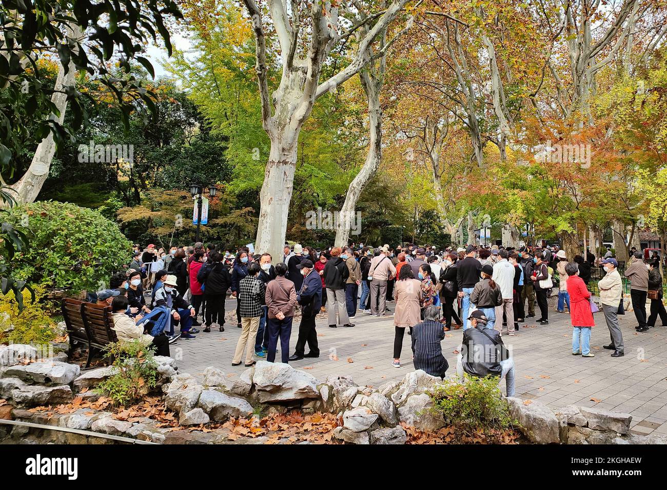 SHANGHAI, CHINA - NOVEMBER 23, 2022 - Elderly people chat to find dates for their children at Lu Xun Park in Shanghai, China, November 23, 2022. It is Stock Photo