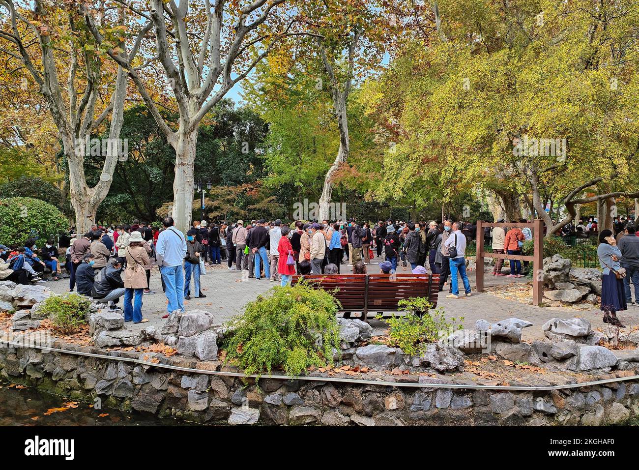 SHANGHAI, CHINA - NOVEMBER 23, 2022 - Elderly people chat to find dates for their children at Lu Xun Park in Shanghai, China, November 23, 2022. It is Stock Photo