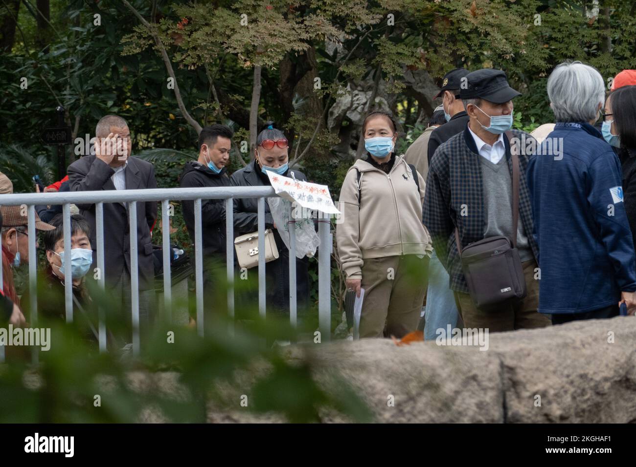 SHANGHAI, CHINA - NOVEMBER 23, 2022 - Elderly people chat to find dates for their children at Lu Xun Park in Shanghai, China, November 23, 2022. It is Stock Photo