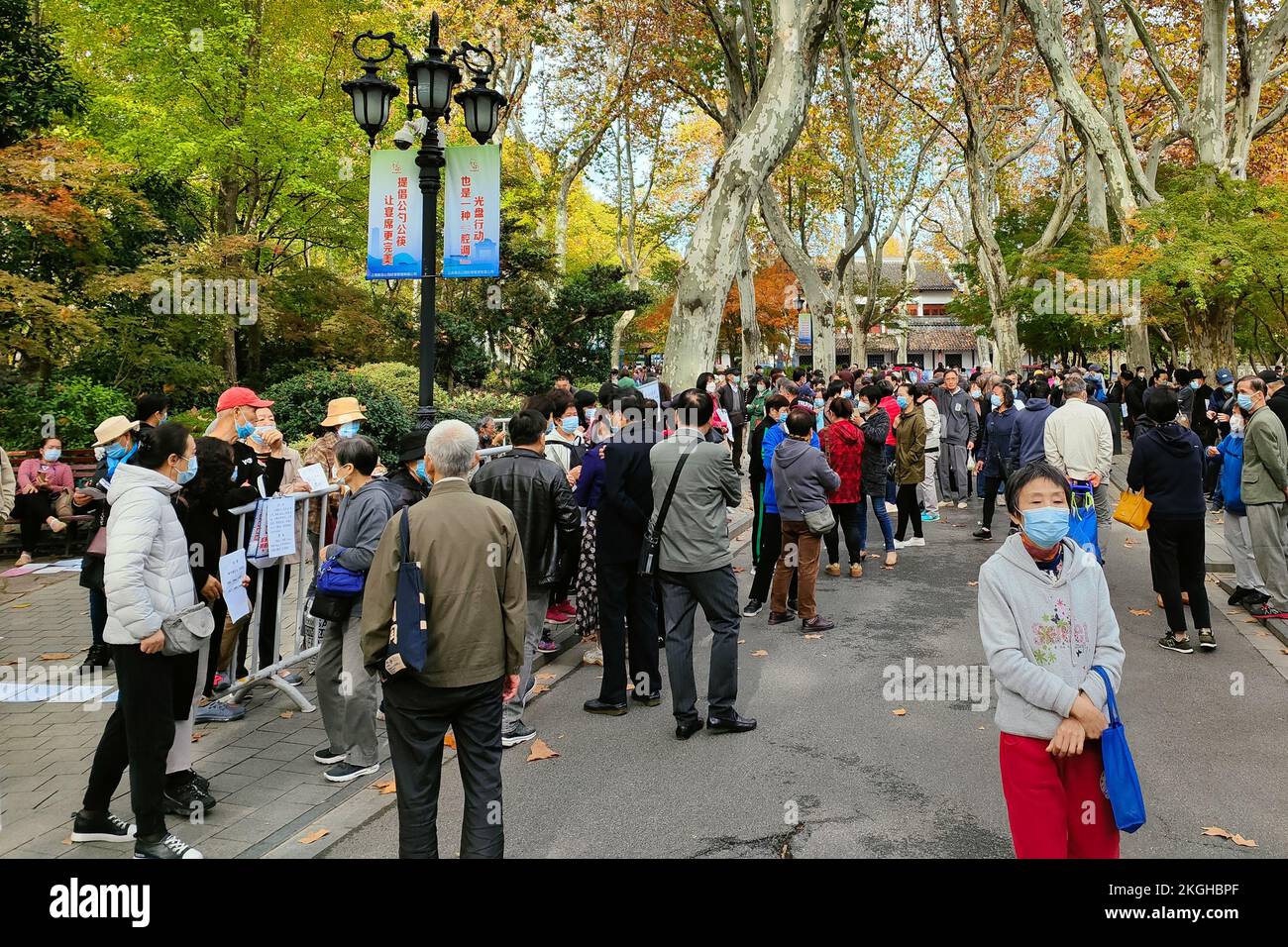 SHANGHAI, CHINA - NOVEMBER 23, 2022 - Elderly people chat to find dates for their children at Lu Xun Park in Shanghai, China, November 23, 2022. It is Stock Photo