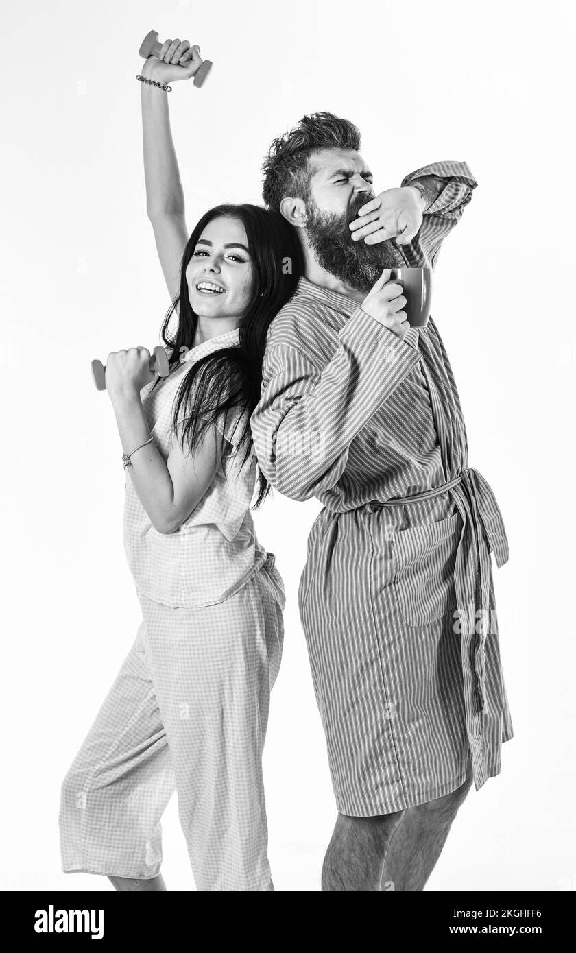 Couple in love in pajama, bathrobe stand back to back. Couple, family